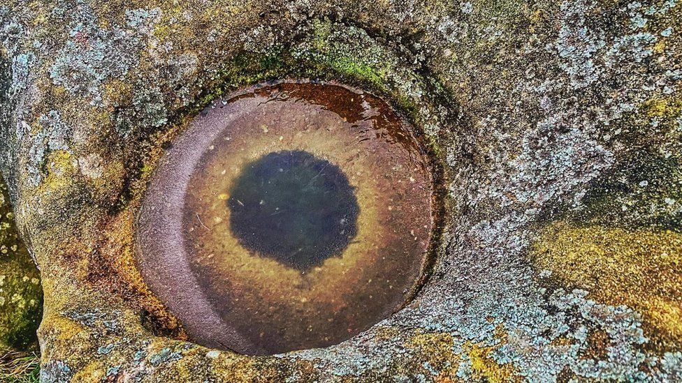 Peak District: Frozen 'fish eye' forms on rock - BBC News