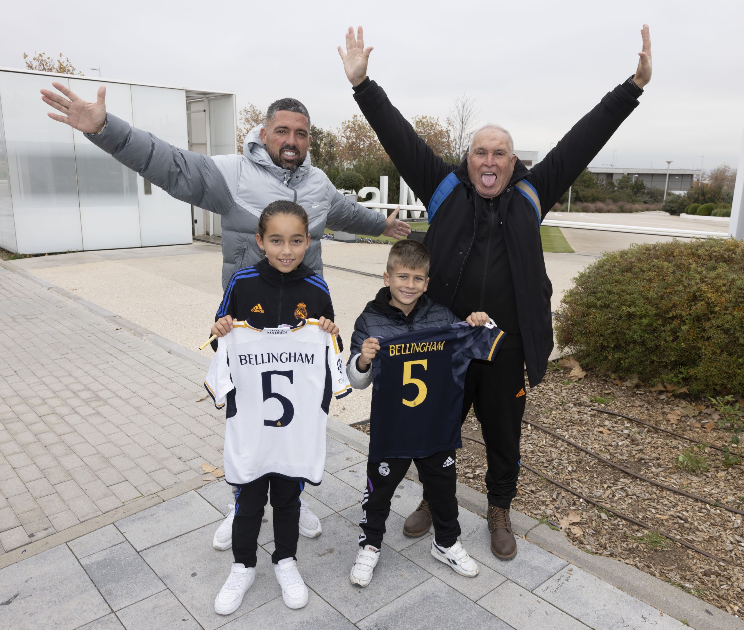 Fans Lucas, Ella, Jose Maria and Pablo wait outside a stadium