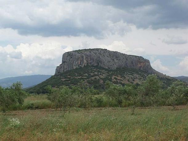 The cave is located on the slopes of a limestone hill overlooking Theopetra village.