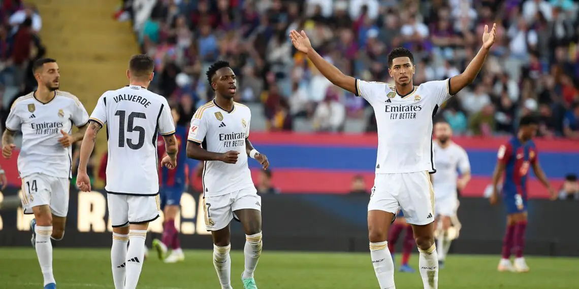 Real Madrid's English midfielder #5 Jude Bellingham celebrates after scoring a goal during the Spanish league football match between FC Barcelona and Real Madrid CF at the Estadi Olimpic Lluis Companys in Barcelona on October 28, 2023. (Photo by Josep LAGO / AFP) (Photo by JOSEP LAGO/AFP via Getty Images)