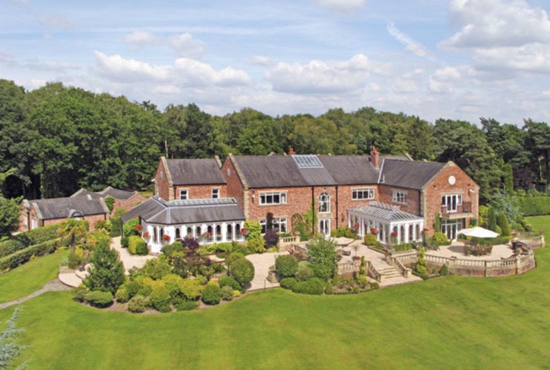 The sprawling seven-bedroom home boasts a helipad, boating and fishing lake